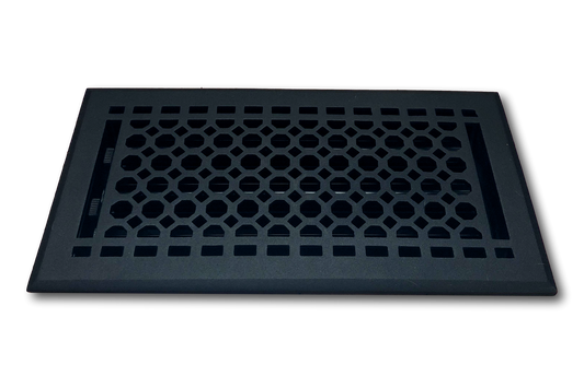 The Madelyn Carter Cast Iron Honeycomb Vent Cover in black, featuring a rectangular geometric pattern, is displayed against a plain white background.