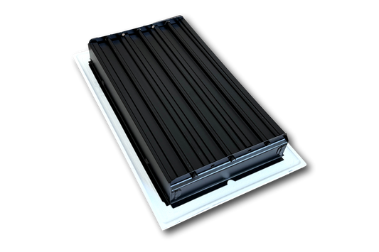 The Madelyn Carter Cast Aluminum Arts & Crafts Vent Cover in white, with vertical ridges, is displayed mounted on a white base against a plain background.