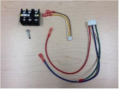The Mitsubishi Separate Power Terminal Block Kit (SPTB1) by Mitsubishi features a black terminal block, a screw, and colored wires with connectors, all displayed on a light wooden surface.