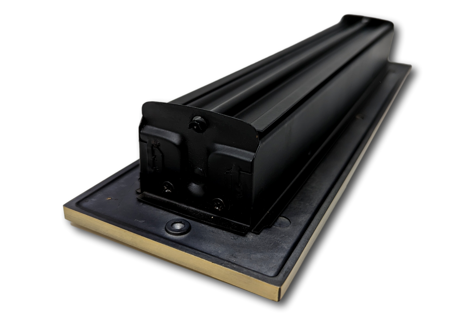 A close-up view of a Cast Aluminum Linear Bar Vent Cover in Antique Brass by Madelyn Carter, mounted on a rectangular base, designed for durability and to seal gaps, much like rust-resistant vent covers.