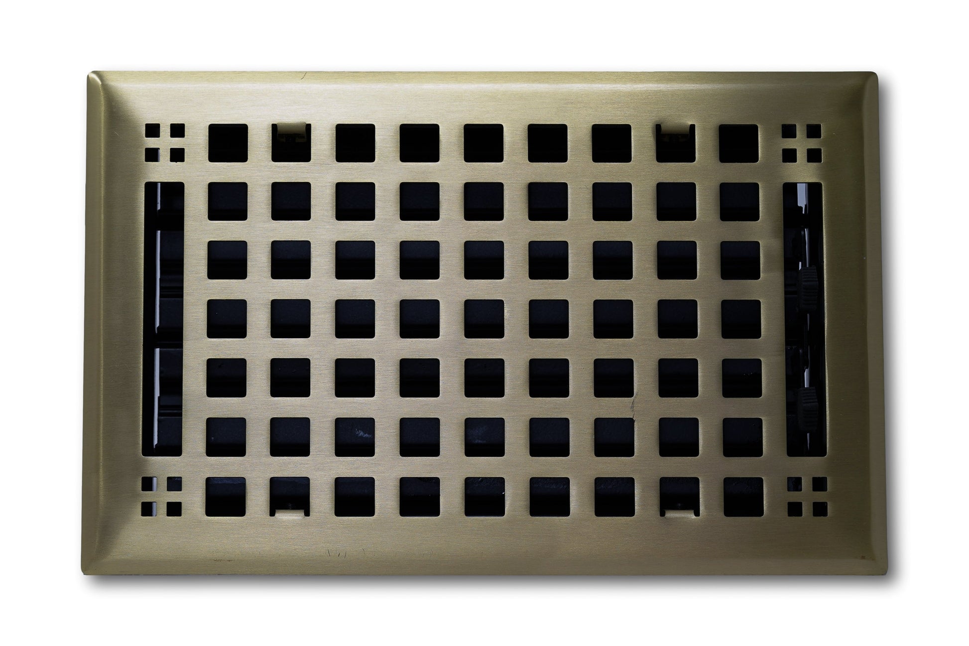 Madelyn Carter Steel Artisan Vent Cover in Antique Brass features a grid of square holes and a decorative border, perfect for floors or walls. Shown from above against a white background.