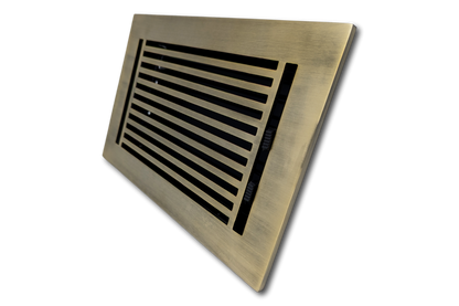 The Madelyn Carter Cast Aluminum Linear Bar Vent Cover in Antique Brass features horizontal slats and a rust-resistant rectangular design, shown at an angle against a white background.