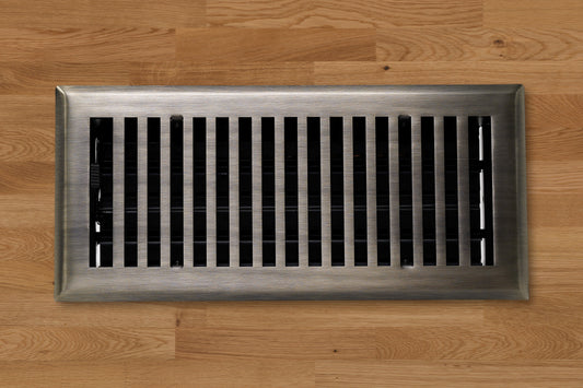 The Madelyn Carter Cast Brass Contemporary Vent Covers in Antique Brass offer a timeless touch with vertical slats, perfect for adding elegance to your wooden floor.