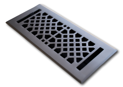 The Madelyn Carter Cast Brass Vintage Industrial Vent Cover in Brushed Nickel features a geometric lattice pattern and is shown at an angle on a white background.