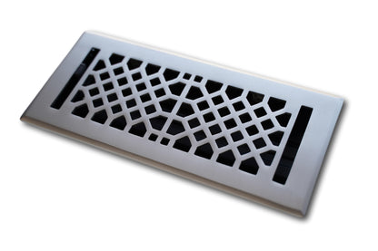 The Madelyn Carter Cast Brass Vintage Industrial Vent Cover in brushed nickel features a rectangular design with a geometric cutout pattern, displayed against a white background.