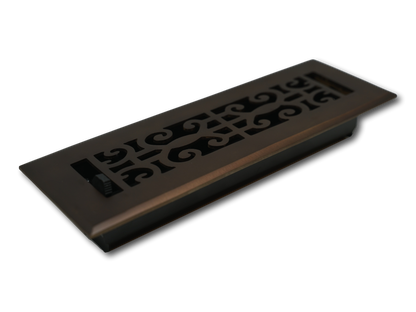 The Madelyn Carter Cast Brass Baroque Vent Cover in Oil Rubbed Bronze features a decorative scroll design, classic baroque inspiration, and an adjustable airflow lever, shown on a white background.