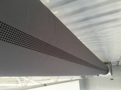 Softducts Fabric Ducts for Greenhouses & Plant Nurseries are long, cylindrical fabric ducts with small perforations, mounted near the ceiling to improve air dispersion in industrial or commercial buildings.