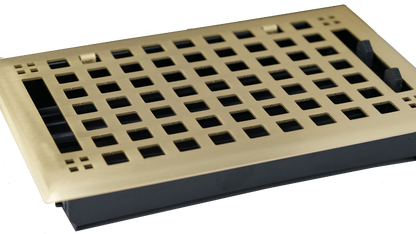 The Madelyn Carter Steel Artisan Vent Cover in Brushed Brass is a rectangular floor vent with a stylish grid design and adjustable black side tabs for easy installation and airflow control.