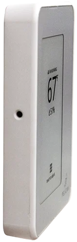 Side view of a Pelican - Touch Thermostat - TC Series by Pelican, a white commercial connected thermostat mounted on a wall, showing the temperature as 67°F.