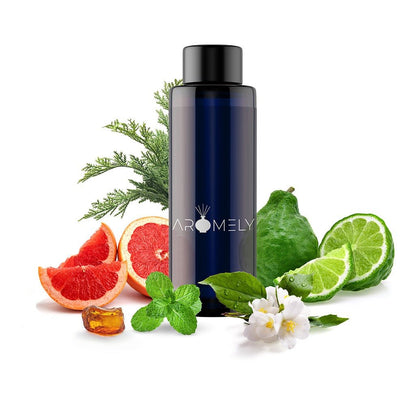 A dark blue AROMELY bottle labeled "Adventurous" sits on a white background, surrounded by grapefruit, lime, mint, white flowers, green leaves, and pine sprigs—hinting at its unique adventurous essential oil blend.
