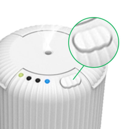 Close-up of the ARO-CAR by Aromely, a white cylindrical portable essential oil diffuser with indicator lights, vent on top emitting vapor using cold air diffusion technology, and a magnified textured button. Bring your favorite fragrances anywhere with AROMELY.