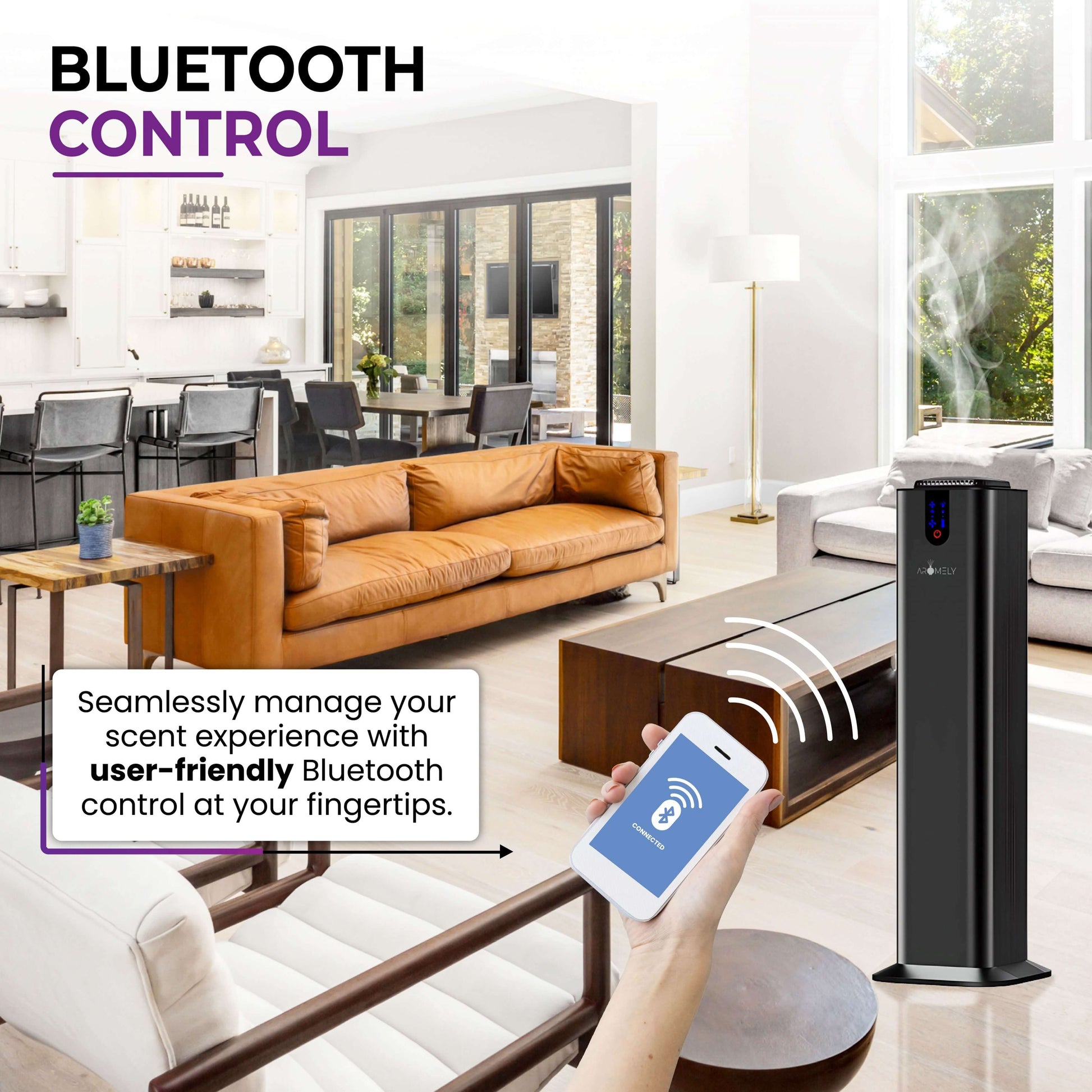 A hand holds a smartphone showing Bluetooth control for the AROMELY Aromely Smart Bluetooth Scent Diffuser, using cold air diffusion in a modern living room with large windows and brown sofas, covering up to 2,000 SQSF (open areas).