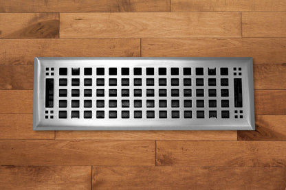 The Madelyn Carter Steel Artisan Vent Cover in brushed nickel features a grid design, blending functionality and style for your wooden flooring.