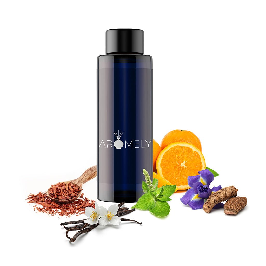 A dark blue AROMELY "Awesome" bottle is surrounded by orange slices, vanilla beans, mint leaves, violets, wood chips, and dried herbs—evoking a floral scent reminiscent of tuberose jasmine.