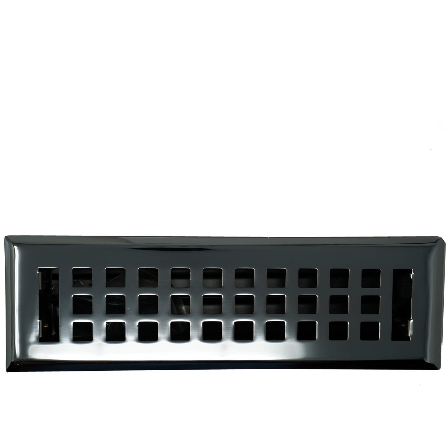 A Madelyn Carter Cast Brass Artisan Vent Cover in polished chrome, featuring a rectangular shape and a grid of square openings, photographed against a white background.