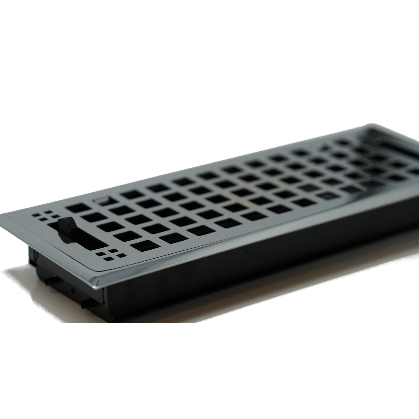 The Madelyn Carter Cast Brass Artisan Vent Cover in Polished Chrome features a rectangular grid design and a black lever for airflow adjustment, offering both style and functionality to your floor vent.