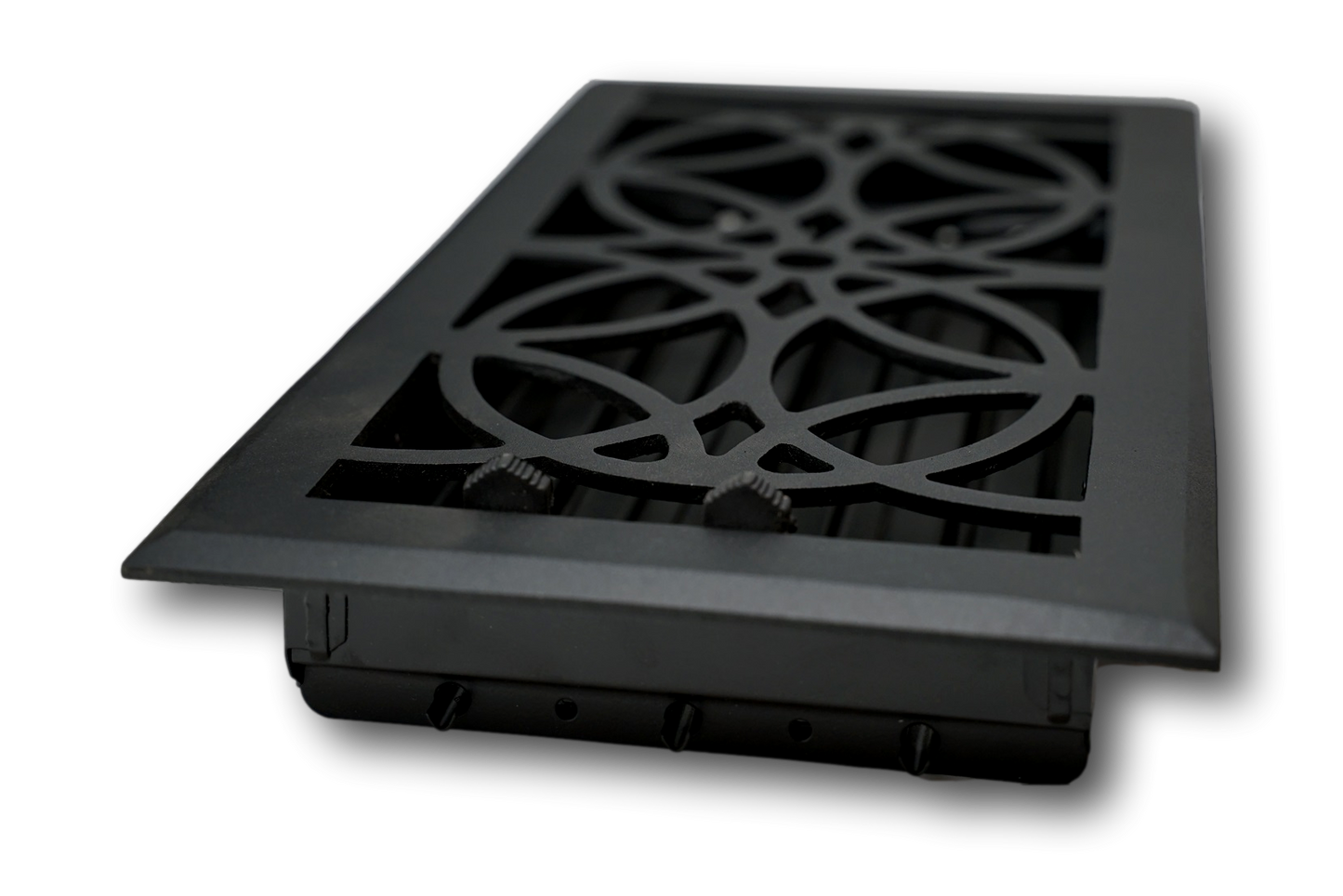 The Madelyn Carter Cast Aluminum Empire Vent Cover in black features a decorative geometric pattern. Stylish and modern, this vent cover is designed for floor or wall installation and shown angled against a white background.