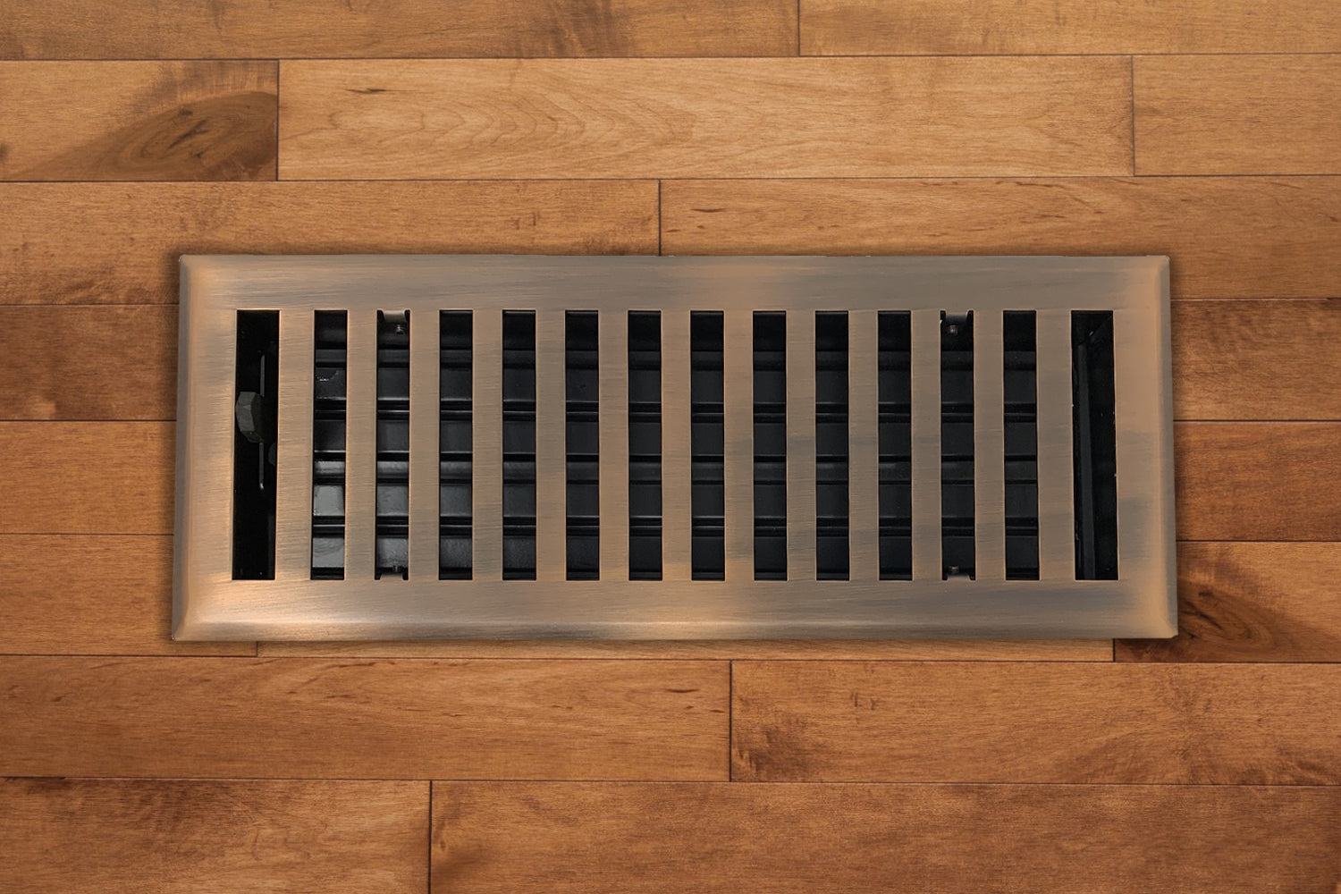 The Madelyn Carter Steel Modern Chic Vent Cover in Venetian Bronze adds a stylish modern touch to any space with its sleek design.