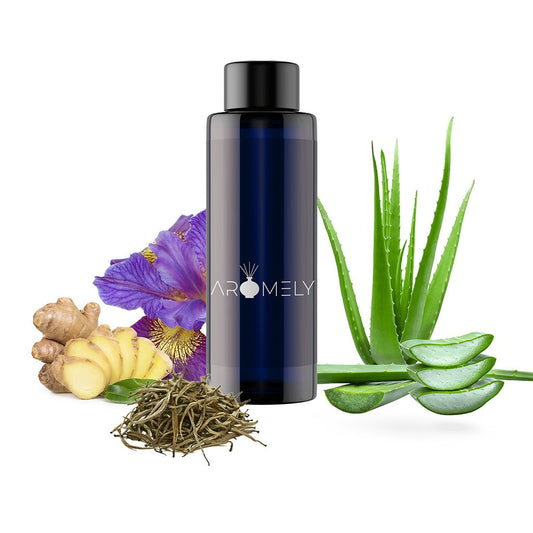 A dark AROMELY "Royal Dreams - Inspired by: Westin Hotels®" bottle sits beside aloe vera, ginger, dried tea leaves, and a purple flower, evoking a signature white tea fragrance on a white background.